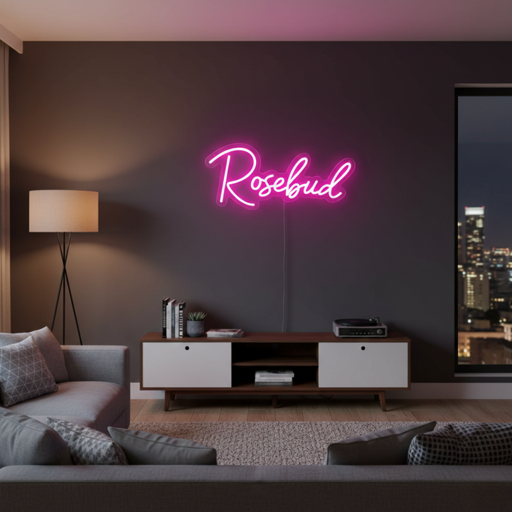 Rosebud Name LED Neon sign by LedNeons.com - glowing softly on a wall, adding a whimsical and personalized decorative touch.
