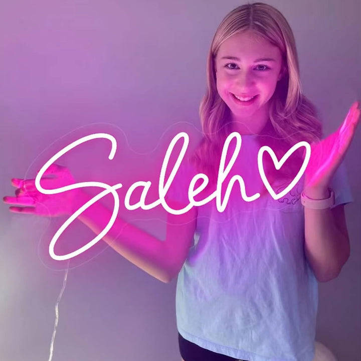 Saleh Name LED Neon Sign by LEdNeons -  glowing in elegant script font on a wall

