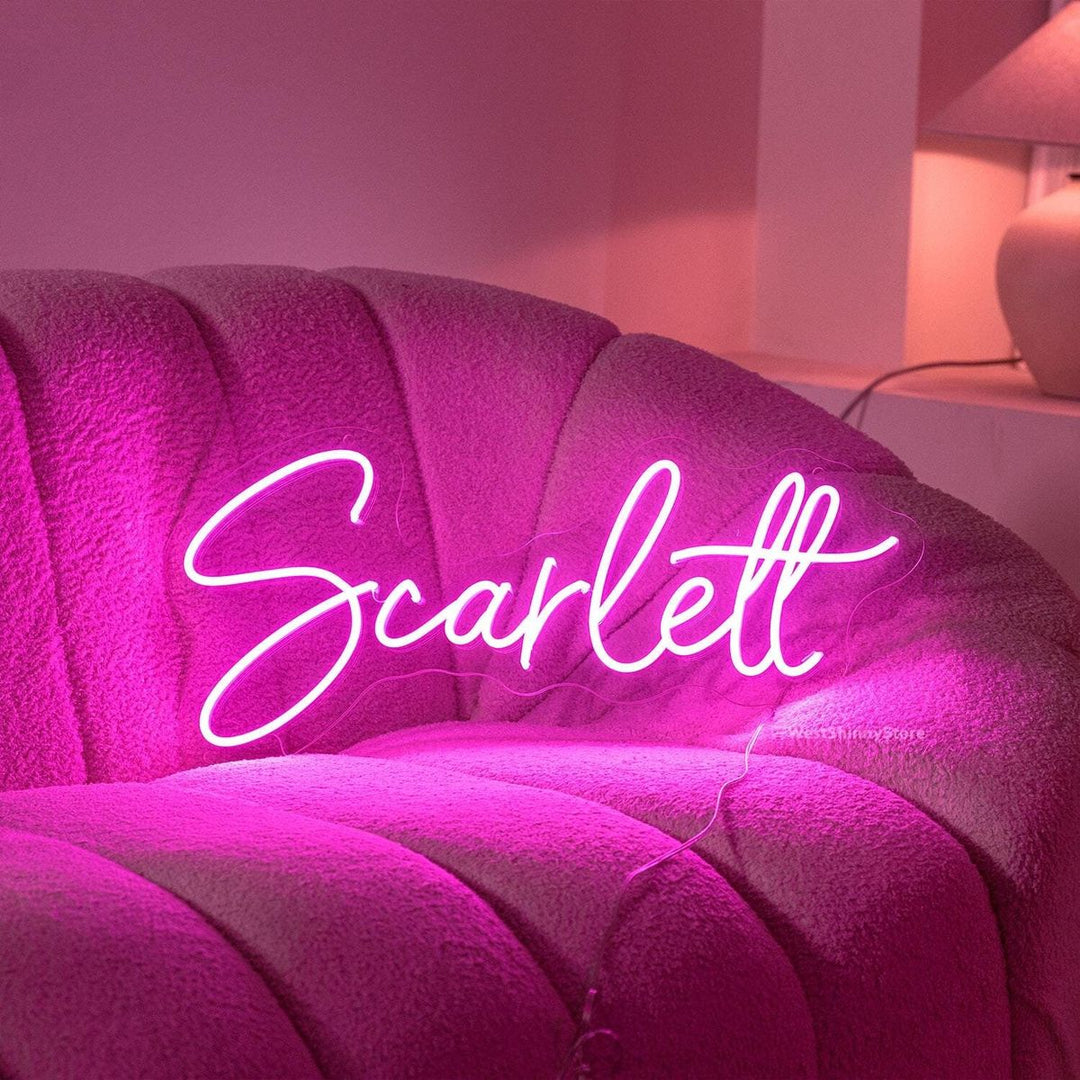 "Scarlett" Name LED Neon sign by LedNeons.com - glowing brightly on a wall, adding a bold and personalized decorative element.