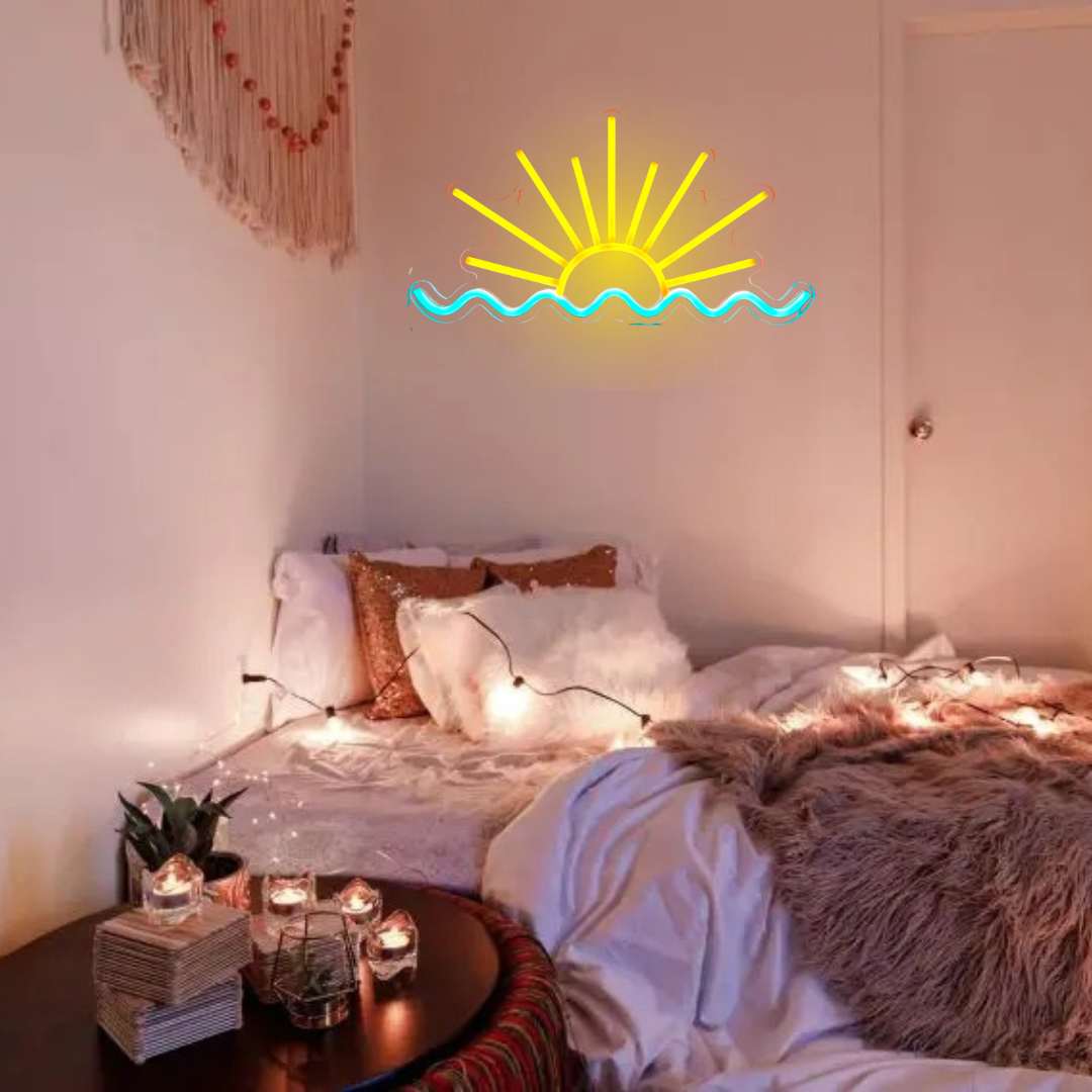 "Sunrise Sunset Home" LED neon sign by LedNeon.com - glowing softly on a wall, creating a warm and serene ambiance in a cozy home setting.