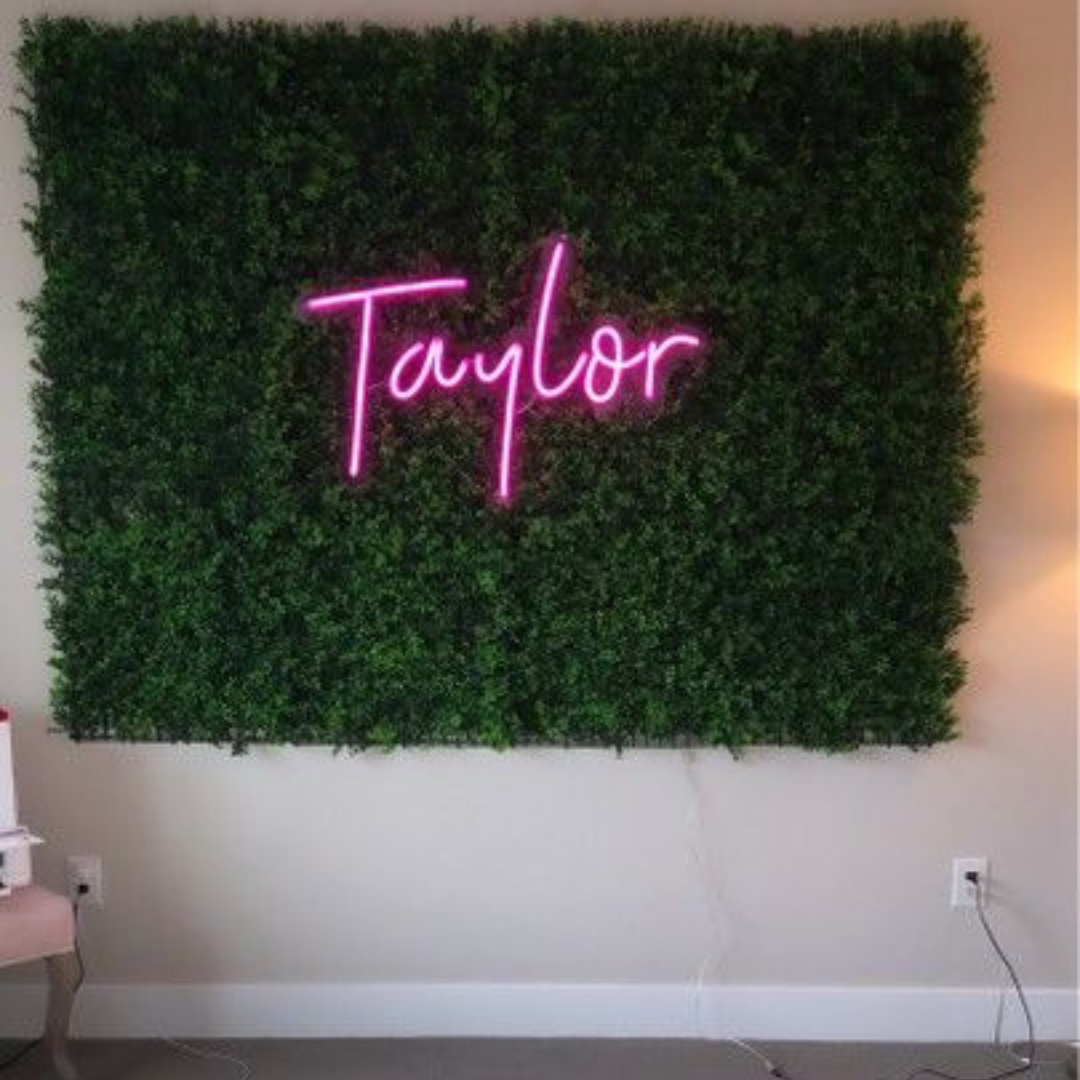 "Taylor Name LED Neon Sign by LEdNeons -  glowing on a wall backdrop"