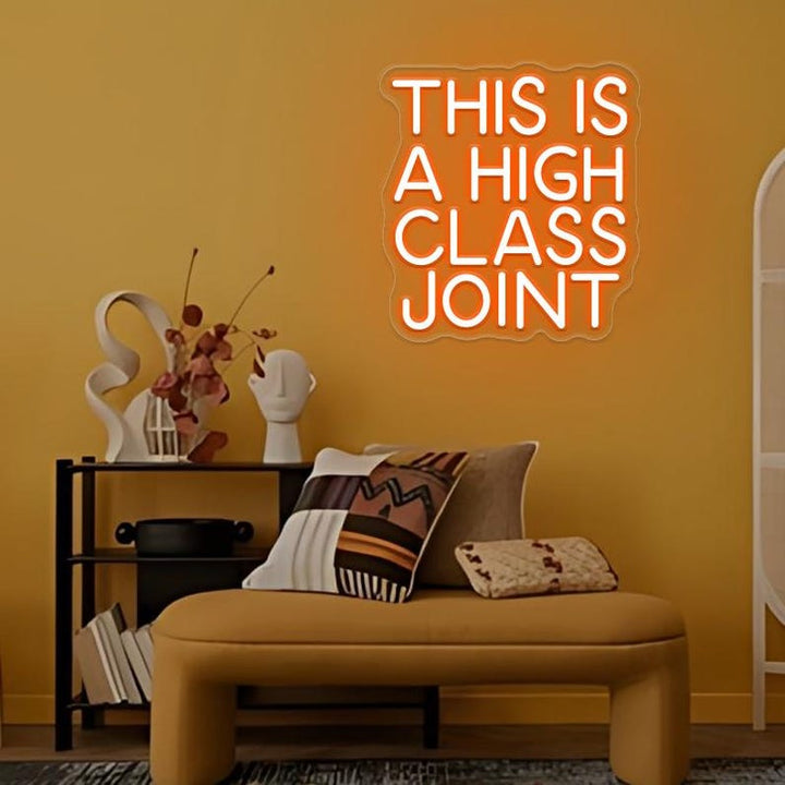 This Is A High Classy Joint LED Neon Sign by LedNeons.com -  with bold, vintage-style neon lettering, ideal for adding a playful and stylish touch to bars or home decor.