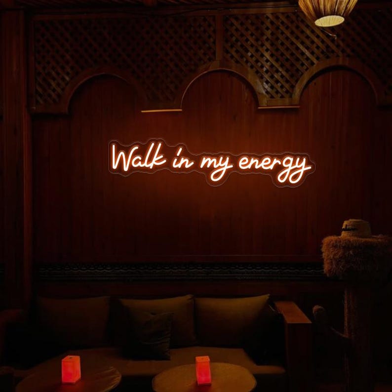 "Walk In My Energy" LED Neon sign by LedNeon.com - glowing boldly on a wall, adding a confident and empowering vibe to the space.