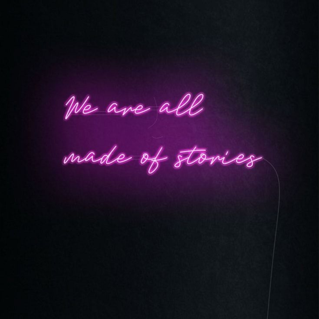 We Are All Made of Stories inspirational LED Neon Sign by LEDNeons, glowing wall light celebrating creativity and individuality.