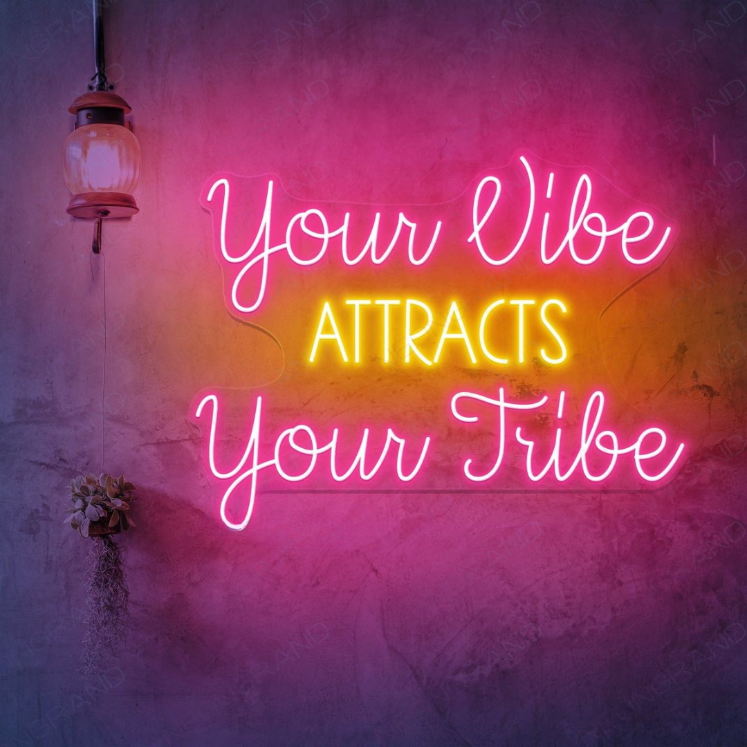 Your Vibe Attracts Your Tribe LED Neon sign by LEDNeons -  glowing brightly on a wall, creating a positive and welcoming atmosphere.