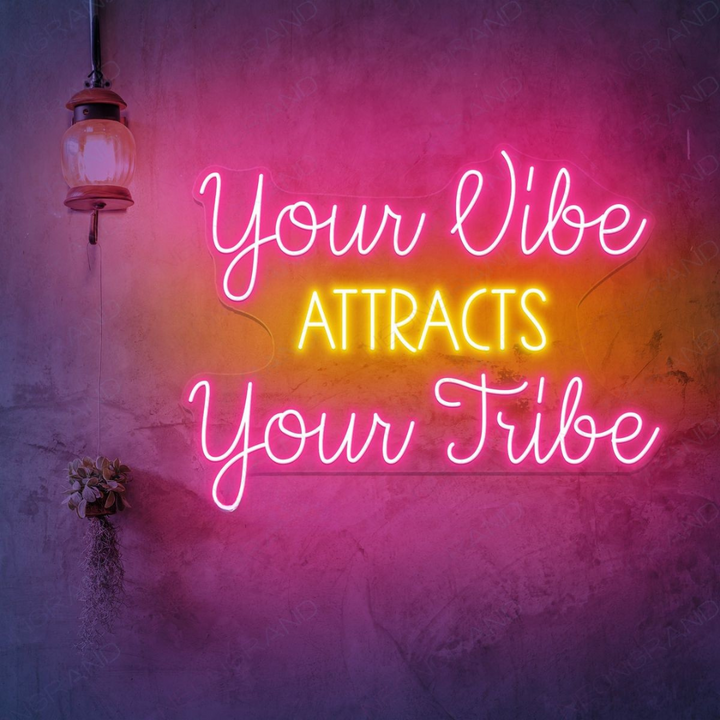 Your Vibe Attracts Your Tribe LED Neon sign by LEDNeons -  glowing brightly on a wall, creating a positive and welcoming atmosphere.
