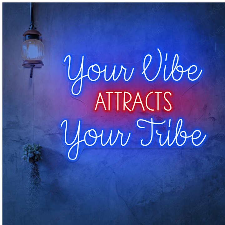 Your Vibe Attracts Your Tribe LED Neon sign by LEDNeons -  glowing brightly on a wall, creating a positive and welcoming atmosphere.